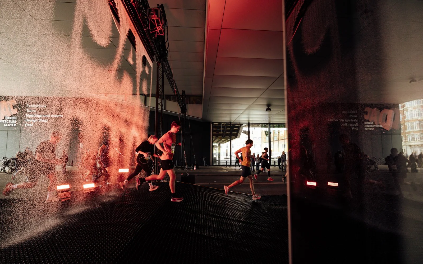 Custom-built water installation with controlled droplet system forming Nike logo for 23,000 marathon runners