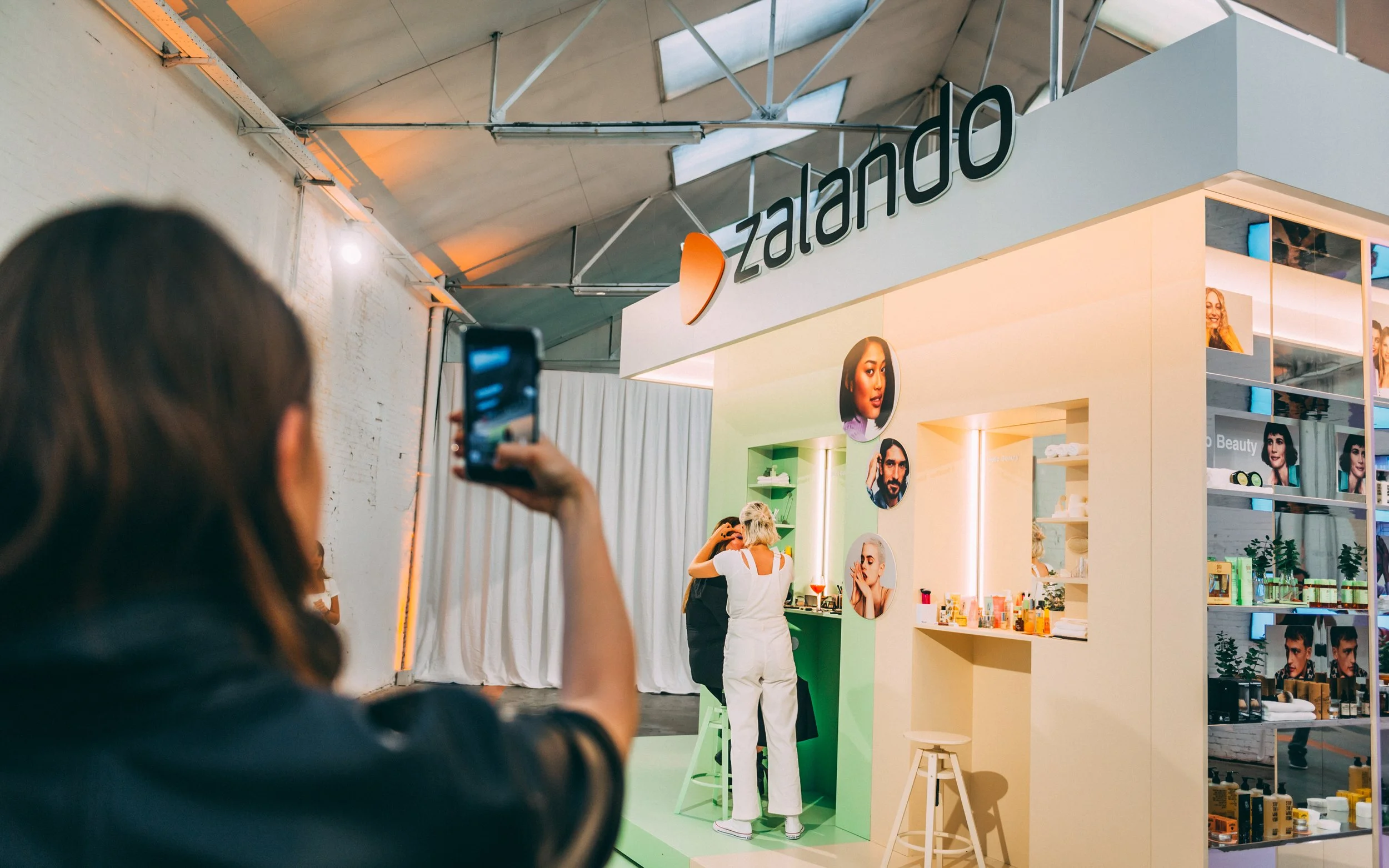 Custom-built beauty experience space with integrated mirrors, lighting and make-up stations for product discovery