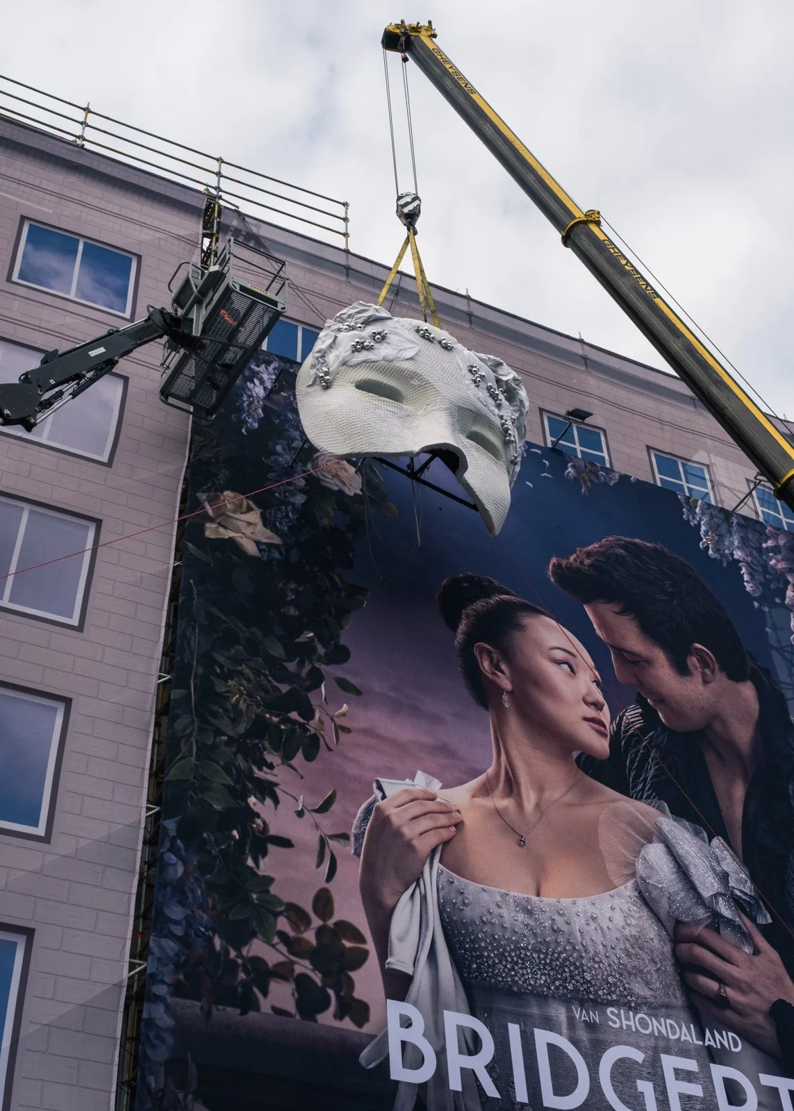 Large-scale scenic mask build mounted on urban billboard structure