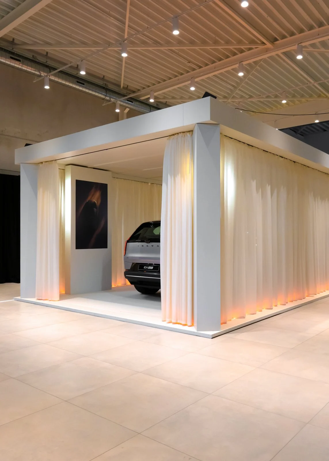 Modular car launch setup with LED lighting and open space layout