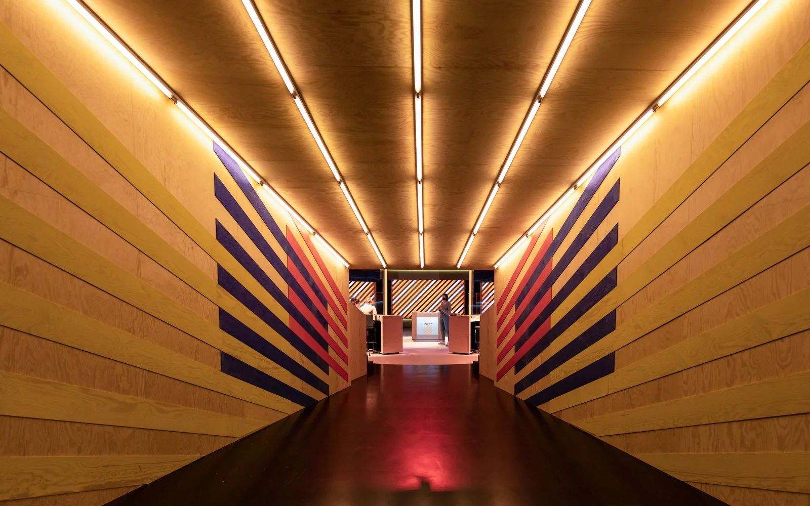 Broadcast studio with elevated seating and competitive quiz setup