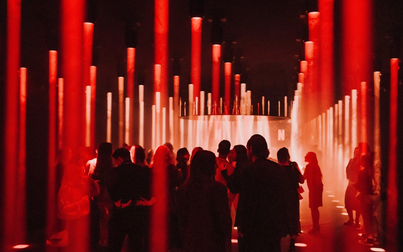 Custom-built event environment blending heritage architecture with modern lighting and club design for Netflix activation
