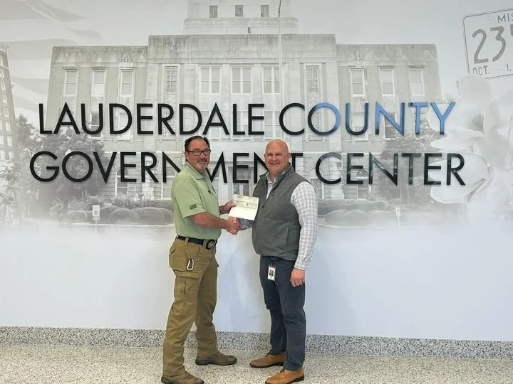 Mississippi Power donates to the Lauderdale County Dive team for new life jackets.