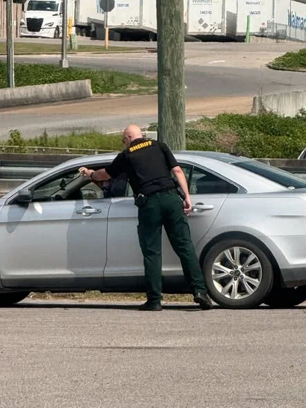 Lauderdale County Sheriff Ward Calhoun takes one person into custody for outstanding warrant near McDonald’s on North Frontage in Meridian.