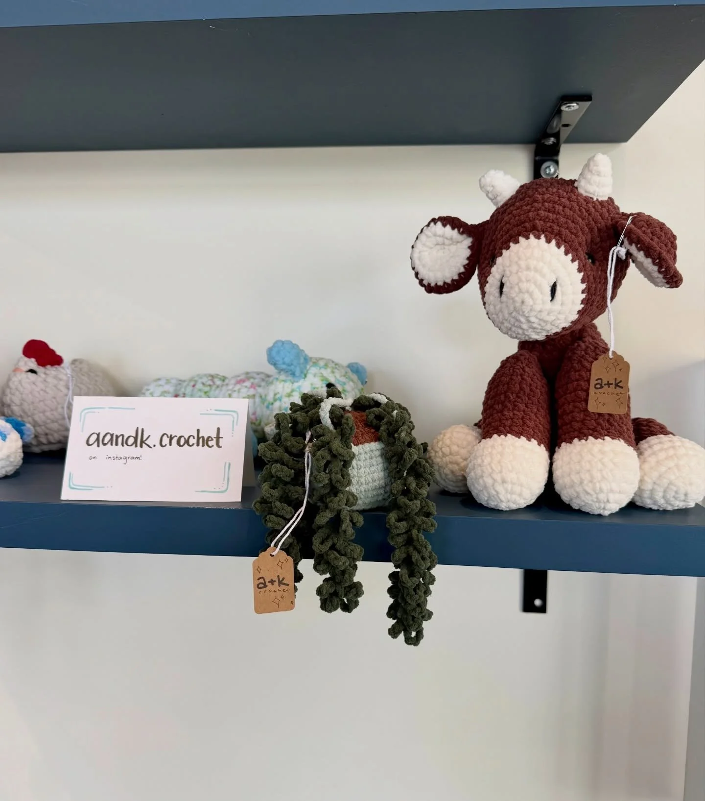 Come check out the newest addition to our shop! @aandk.crochet, a very talented, local, sister duo has taken over this shelf with the cutest creations! 🐮🪴🐣