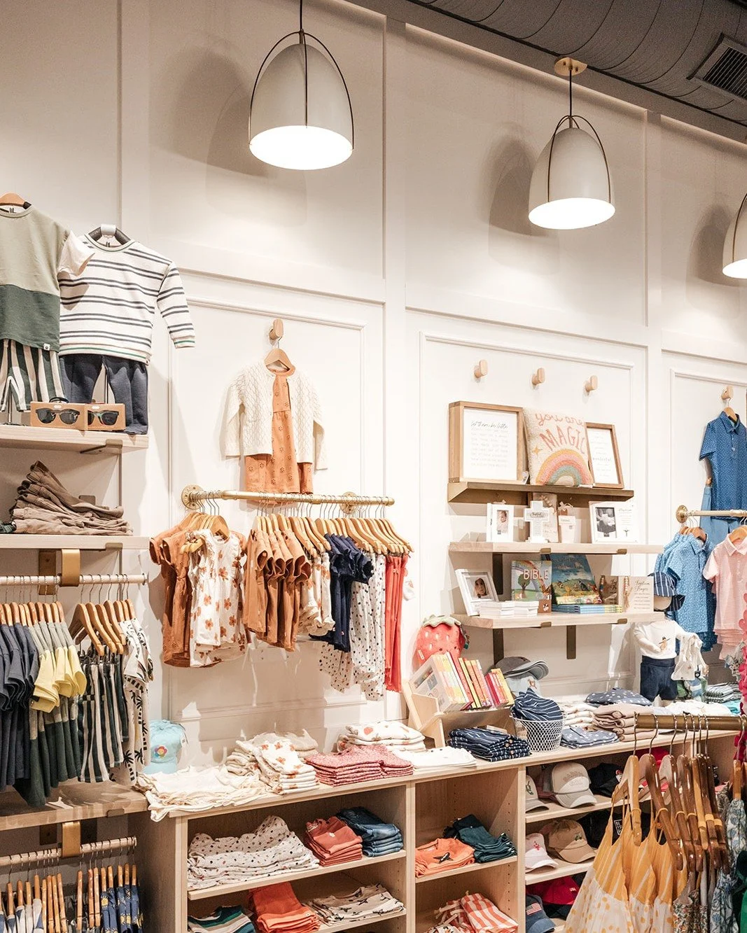 Thoughtful millwork and custom shelving are the unsung heroes of boutique design. At Dolce Vita Baby Boutique, displays are organized yet flexible, complementing the interior without competing with the merchandise. Each feature is curated to highligh