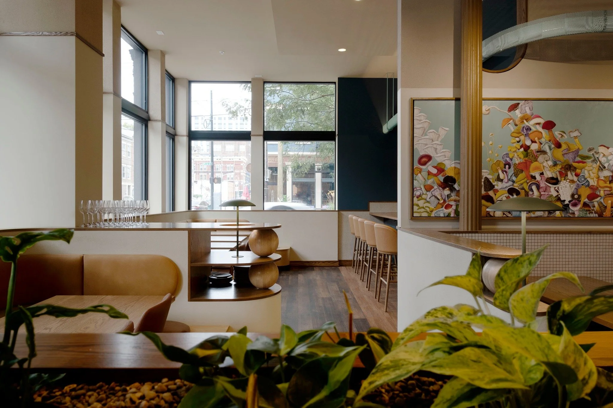 Have you been to @wildweed.cinci yet? The interior at Wildweed draws inspiration from the menu, with earthy tones and layered textures that echo the natural, seasonal ingredients. Warm woods and deep blue tiles create a grounded backdrop, while the m