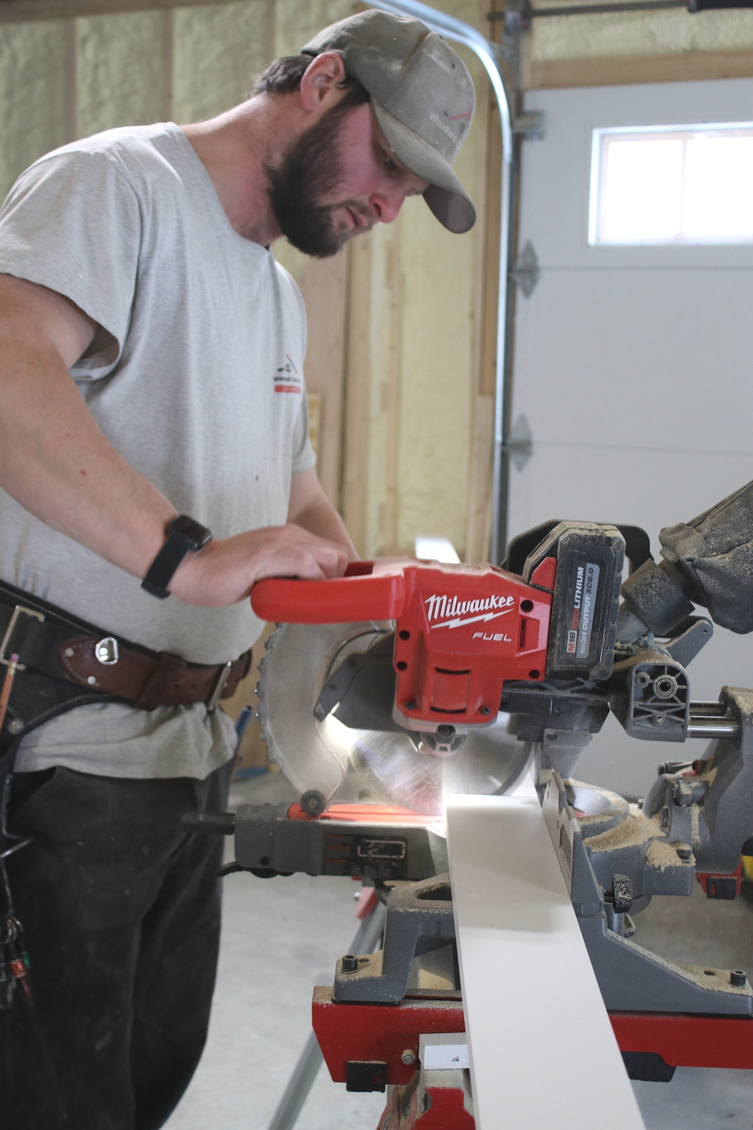Founder, Scott, onsite, cutting board to length using precision.