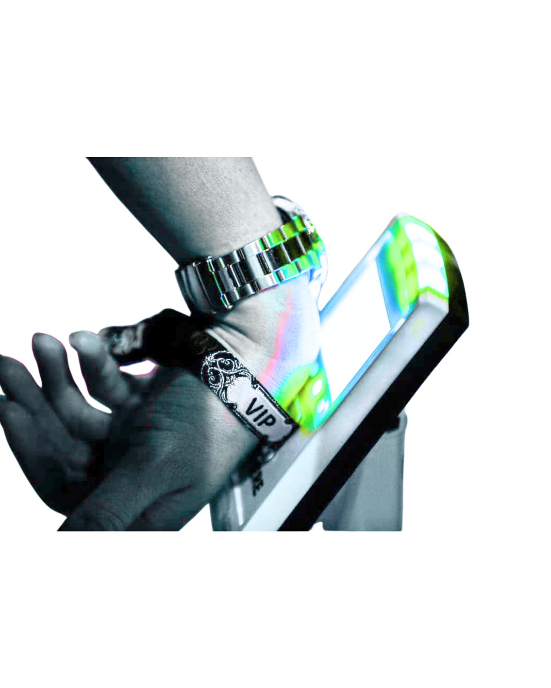 A person with a VIP bracelet and watch using a smartphone with a bright screen.