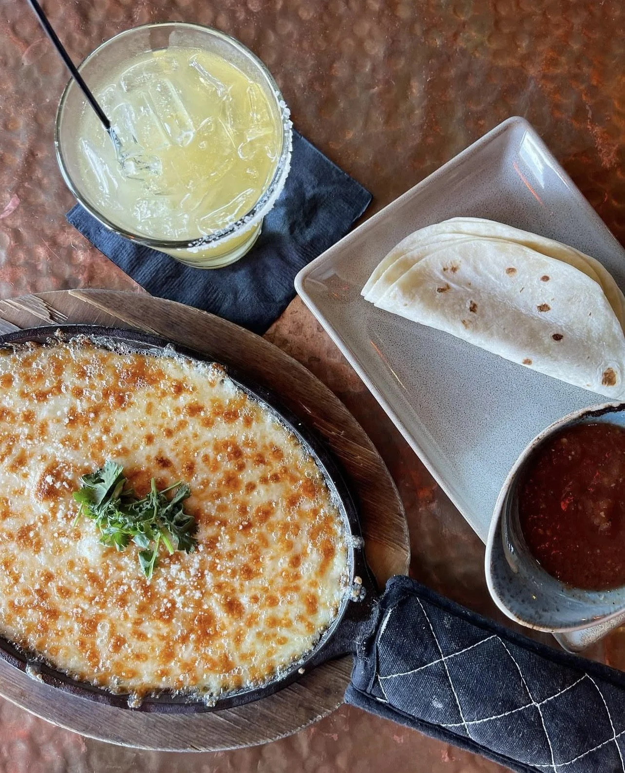 Cheesy, melty, and made to share 🧀✨

Our Queso Fundido is a rich blend of Mexican cheeses, served bubbling hot with cantina salsa and warm flour tortillas&mdash;perfect for dipping into every bite.

Not feeling the skillet? Substitute with our class