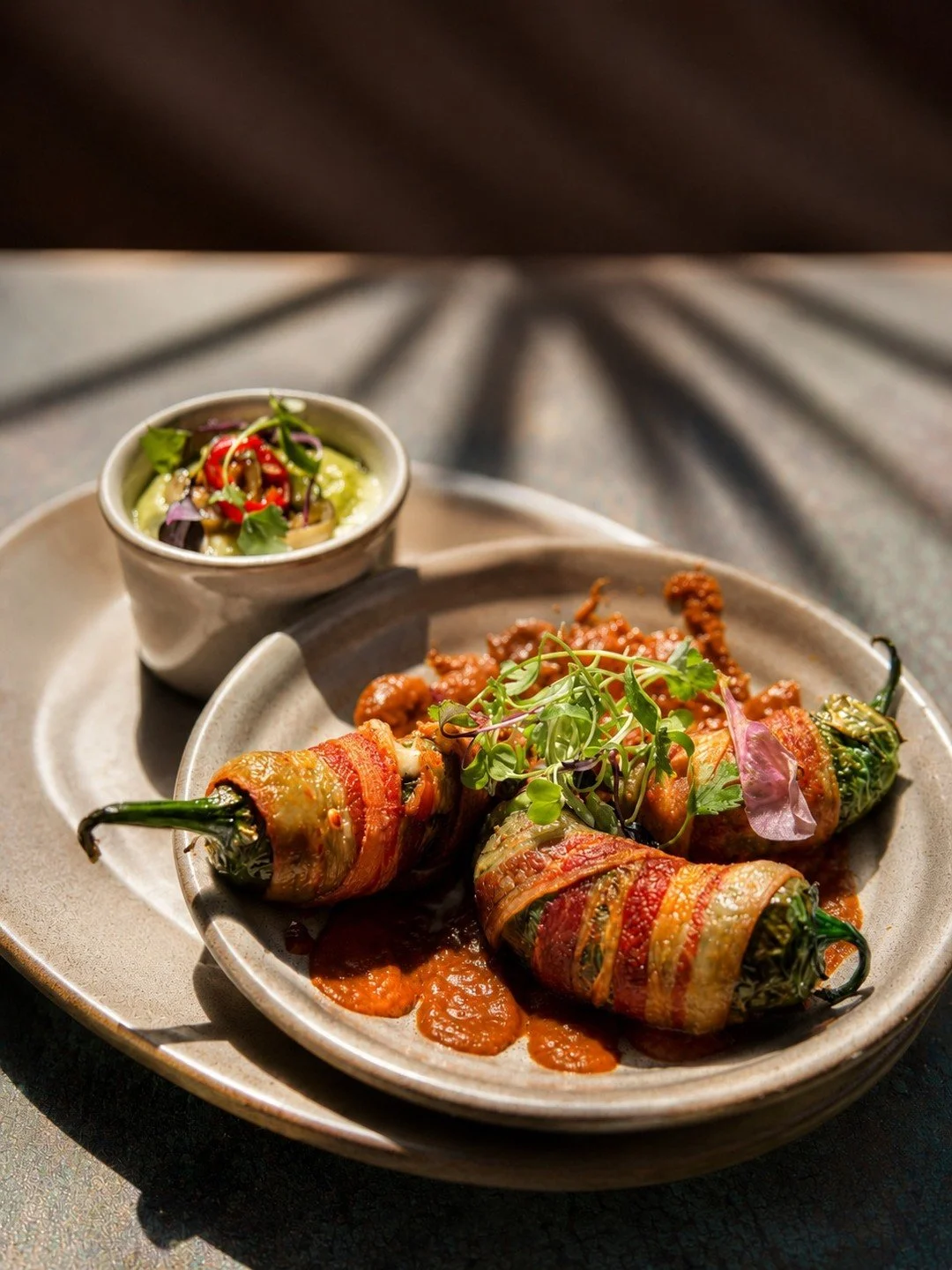 Introducing Smoked Jalape&ntilde;o Bites 🌶️🥓

Bacon-wrapped jalape&ntilde;os stuffed with melted manchego and chihuahua cheese, served with creamy avocado salsa and smoky ranchero sauce. Bold flavor, just the right heat, and impossible to share.