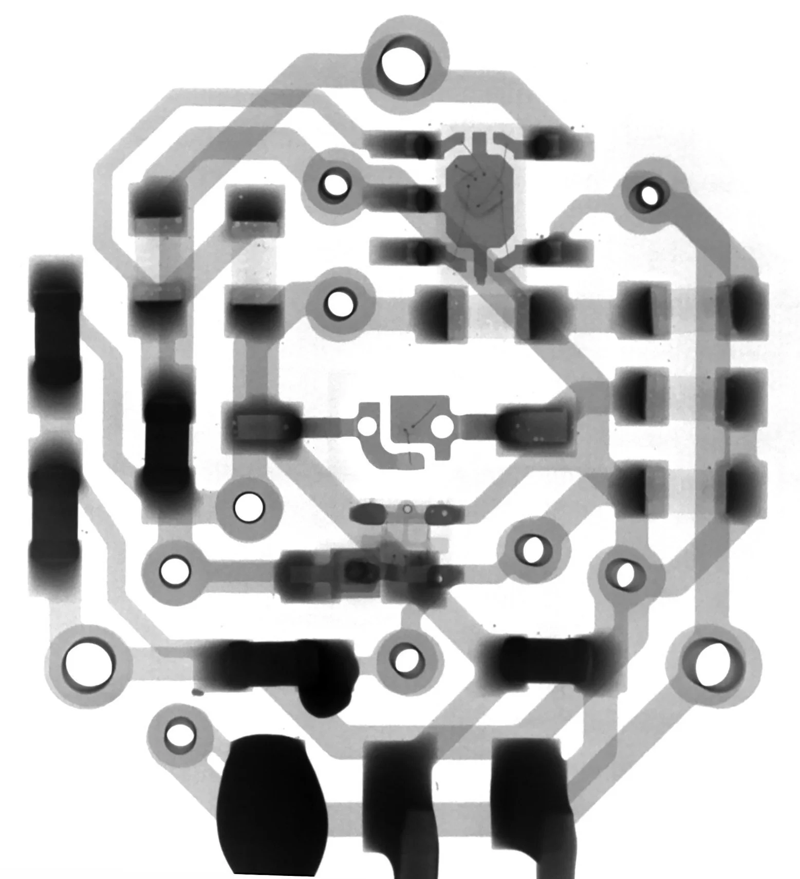 X-ray image of an electronic circuit board showing components and traces