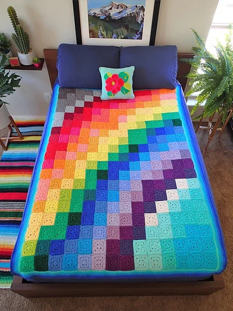 Rainbow_Joy_blanket_on_bed_1_medium2.webp