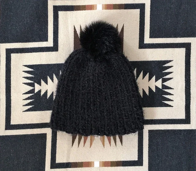 Soft_Black_Adult_Beanie_on_blanket_medium2.webp
