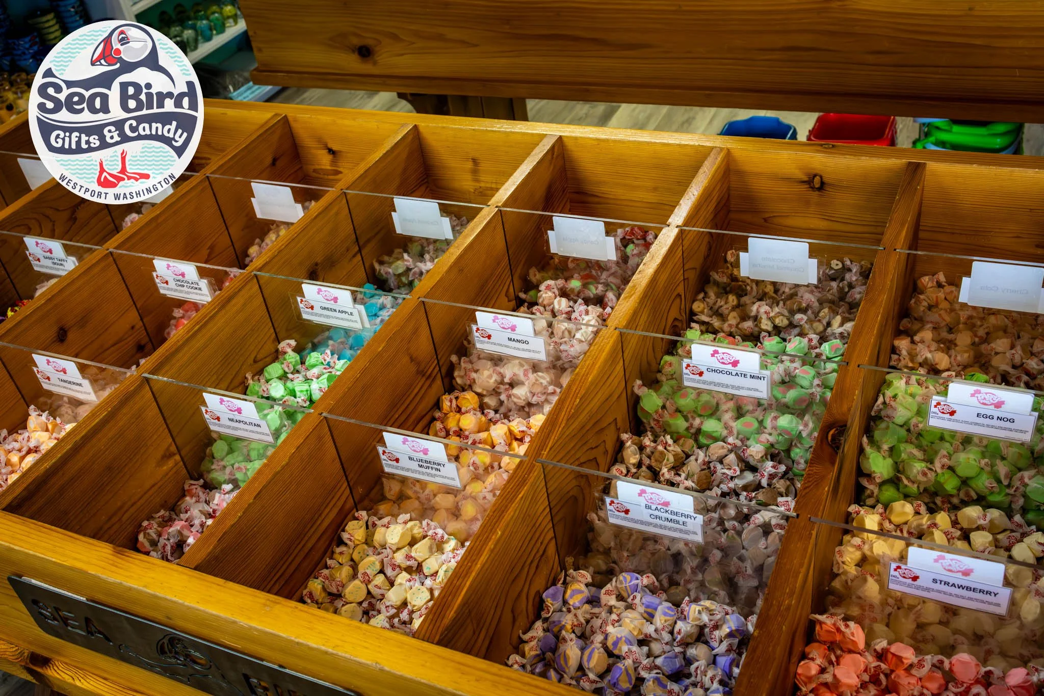 Colorful salt water taffy display at Sea Bird Gifts & Candy in Westport, WA, featuring assorted flavors inside the coastal candy and gift shop.