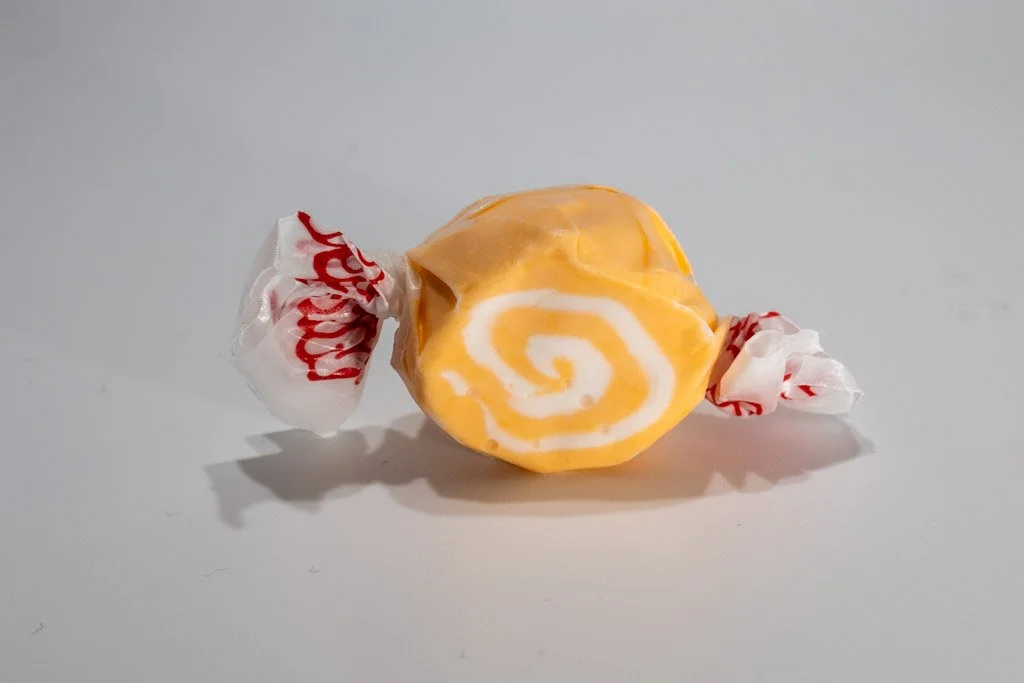 Orange and white swirled orange cream saltwater taffy from Sea Bird Gifts & Candy in Westport WA. Classic candy with a smooth citrus-vanilla flavor.