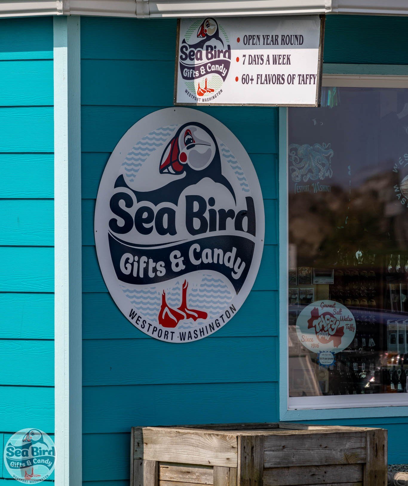 Sea Bird Gifts & Candy storefront sign in Westport, WA, featuring the local candy and gift shop known for salt water taffy, coastal gifts, souvenirs, and year-round shopping.