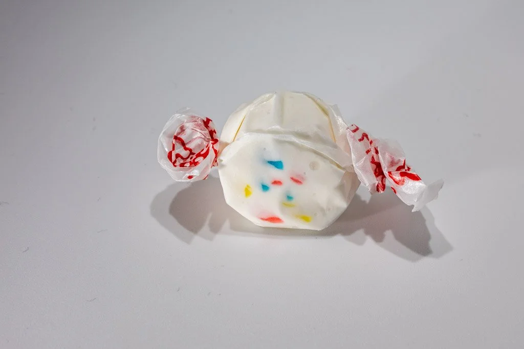 White frosted cupcake saltwater taffy with colorful rainbow sprinkles from Sea Bird Gifts & Candy in Westport WA. Fun, festive taffy wrapped in wax paper.