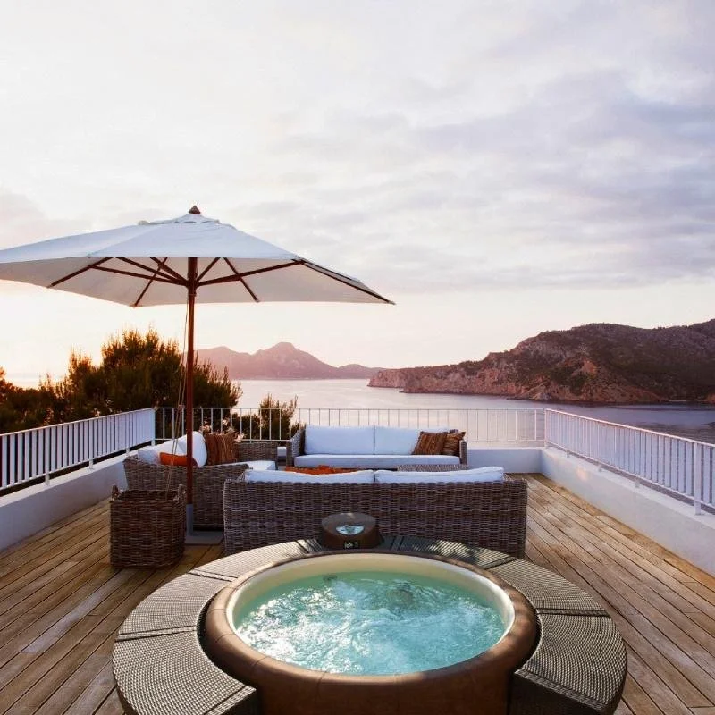 Softub portable hot tub set out on a deck overlooking the ocean