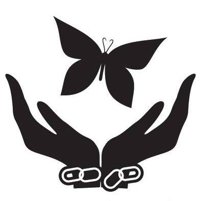 Silhouette of hands breaking chains releasing a butterfly