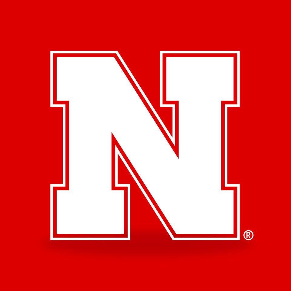 White block letter 'N' with red outline on a red background.