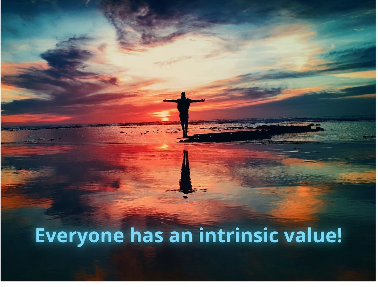 Silhouette of a person with arms outstretched standing on the beach during sunset with vibrant red, orange, and blue sky. Reflective water surface. Text: Everyone has an intrinsic value!