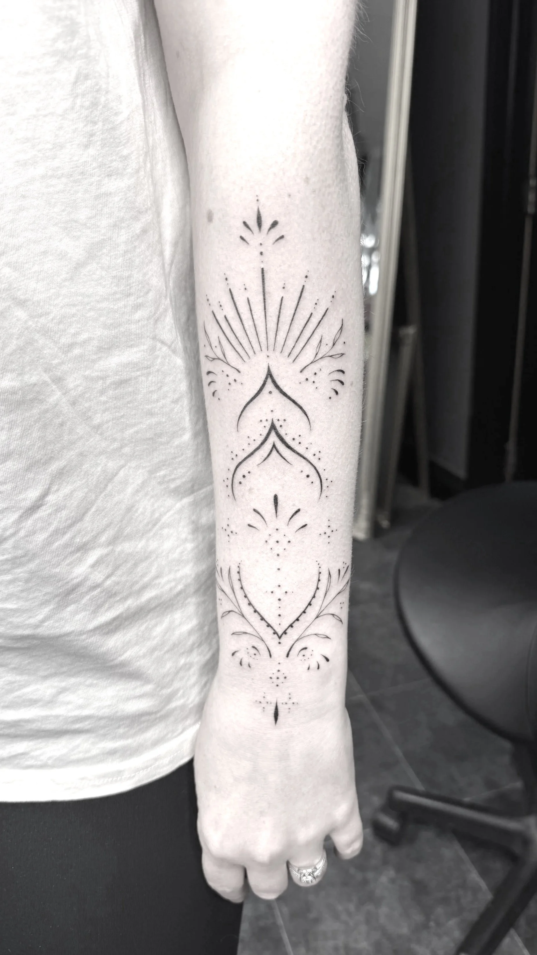 Ornamental fineline tattoo black leaf feminine female artist nz South Island 