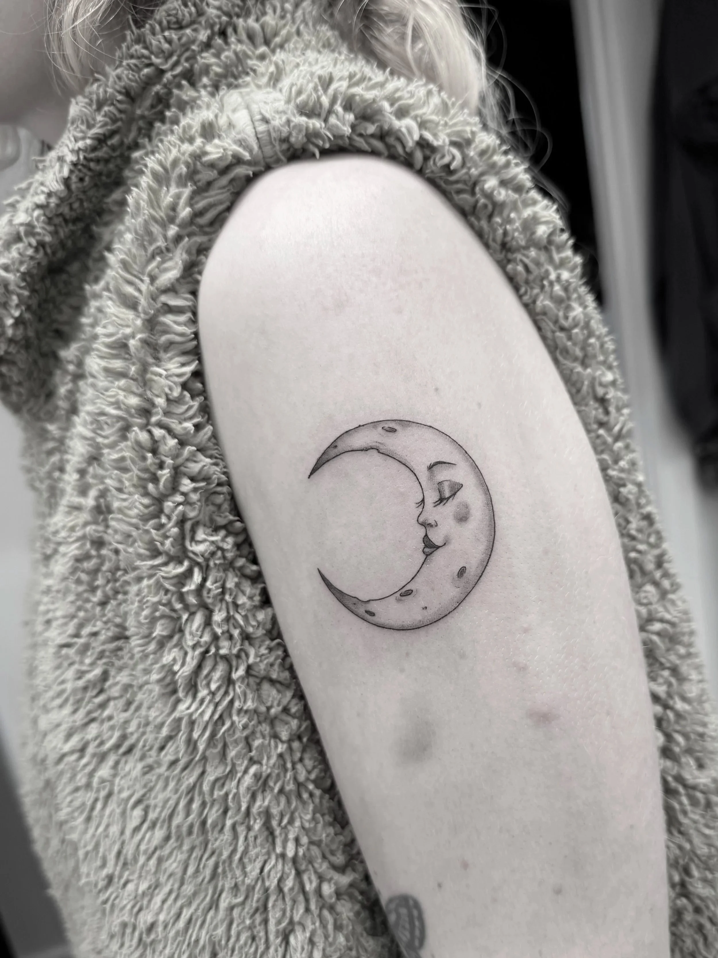 Fine moon female Luna tattoo on arm and shoulder in South Island in otago