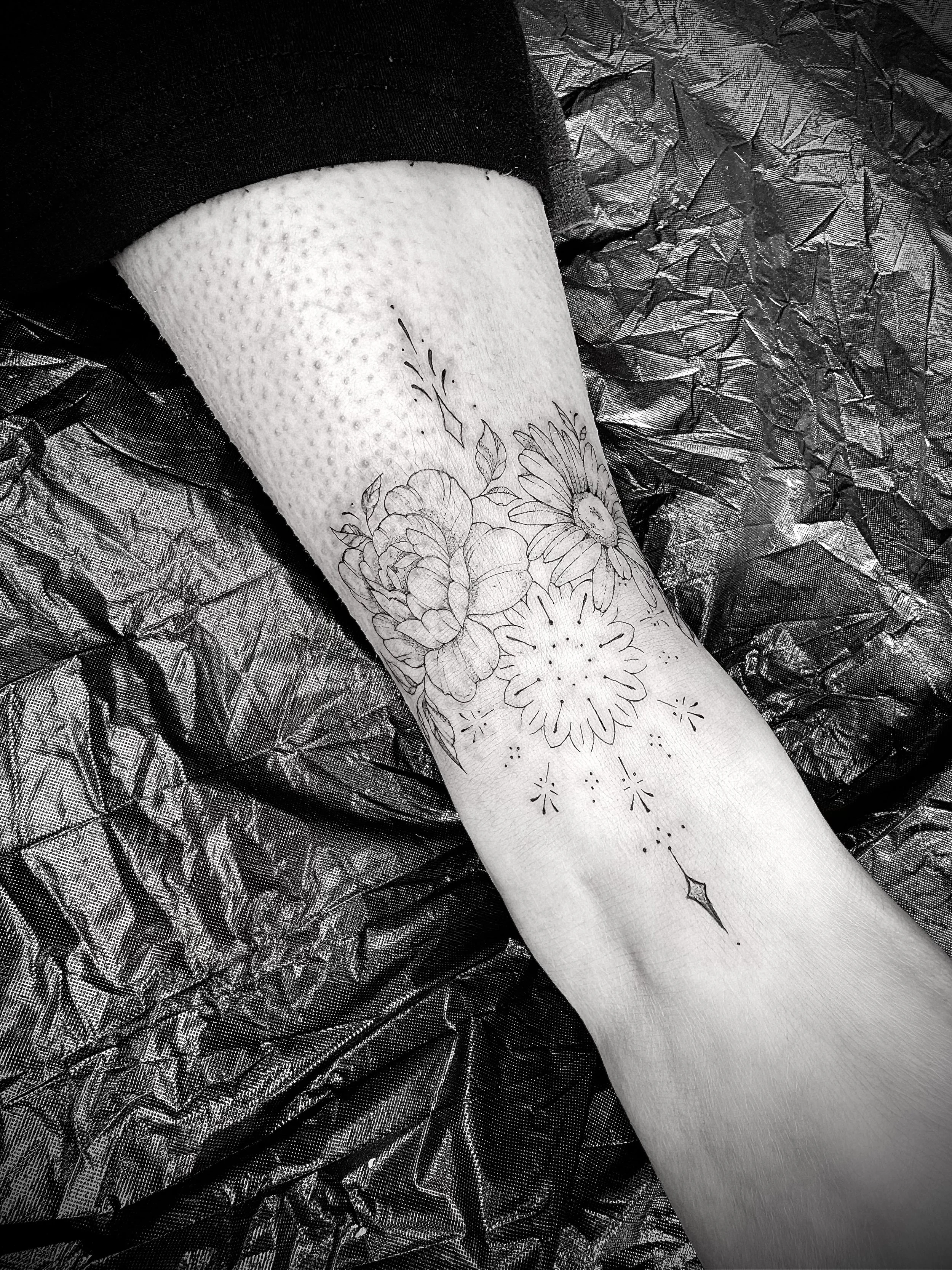 Fine line ornamental mandala ankle tattoo done in invercargill