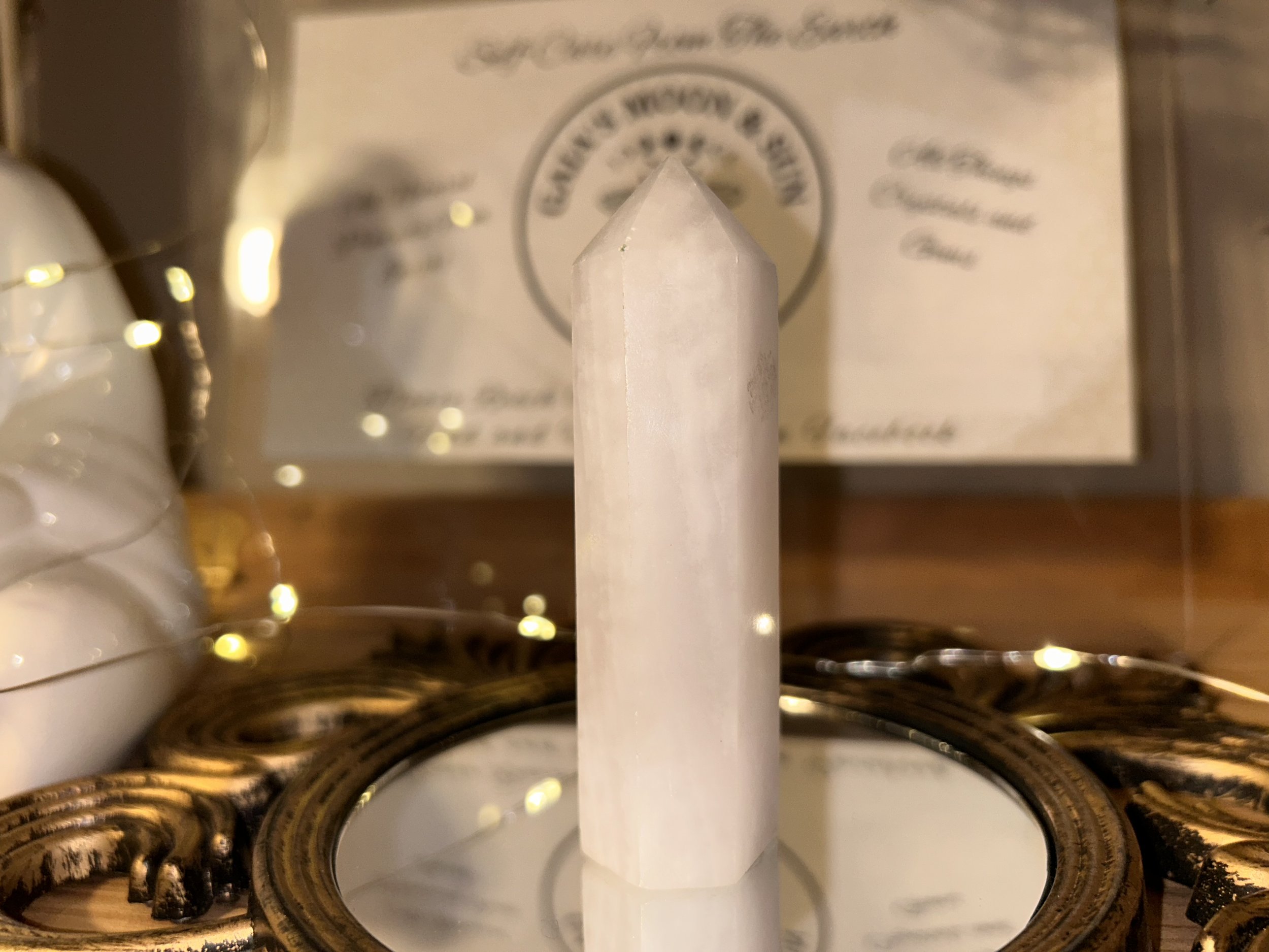 Bright Mango Calcite crystal tower with golden-orange tones, used for motivation, confidence, and solar plexus energy work.