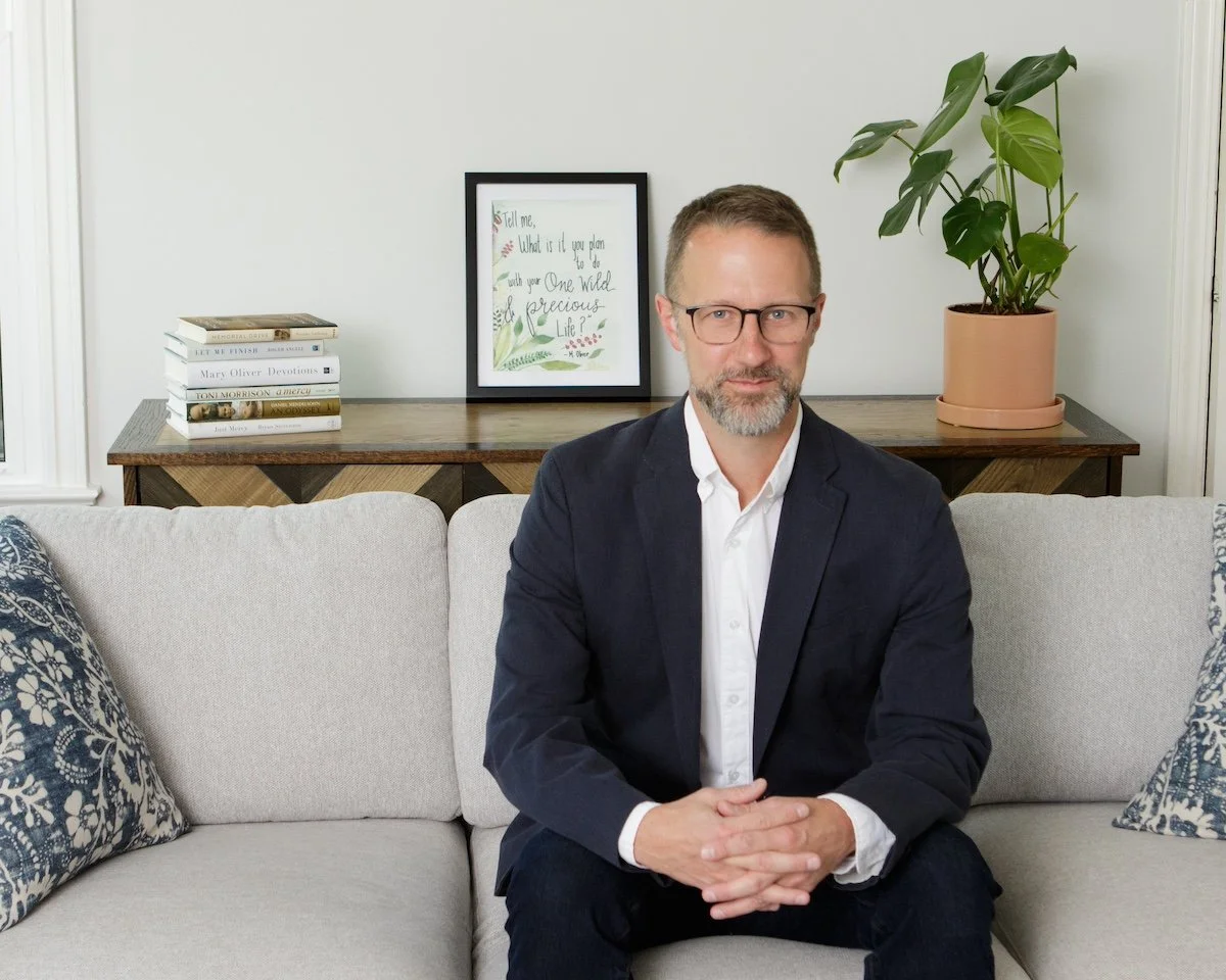 Executive function coach Chris Copeland on a couch.
