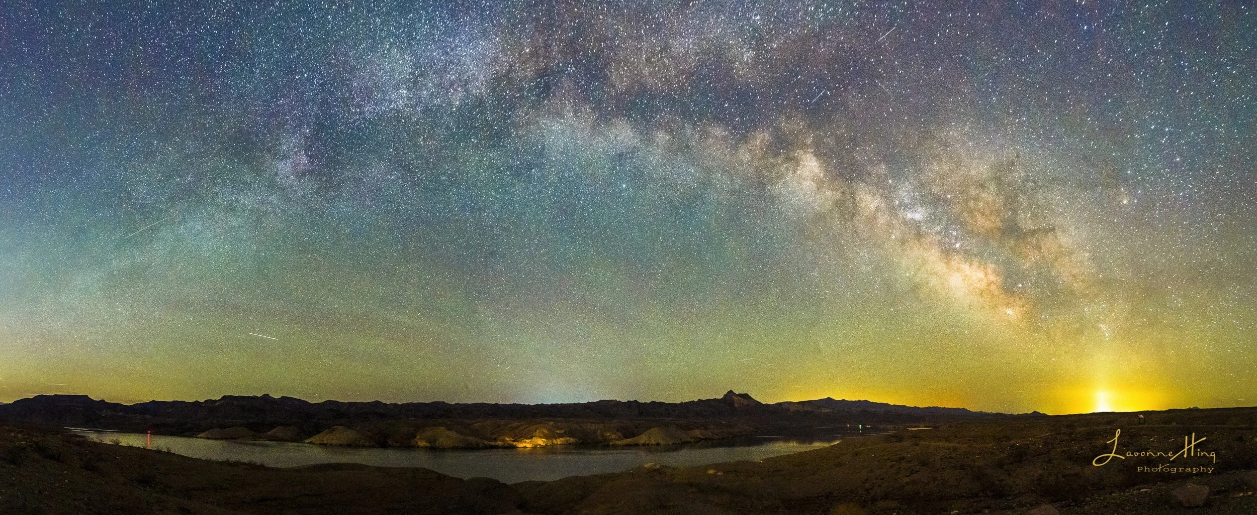 Full Milky Way Arch of Lake Mead National Park, NV.  Taken from a South East facing in early Milky Way season.  The Core is aglow in the right side of the arch.  Local AZ air glow is also seen from here.  UnTracked, Nikon D850.