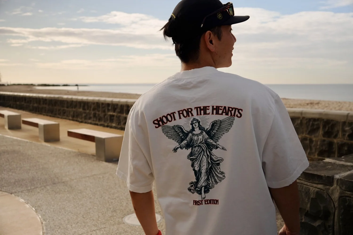 Tomoya wearing a Merak shirt by the water