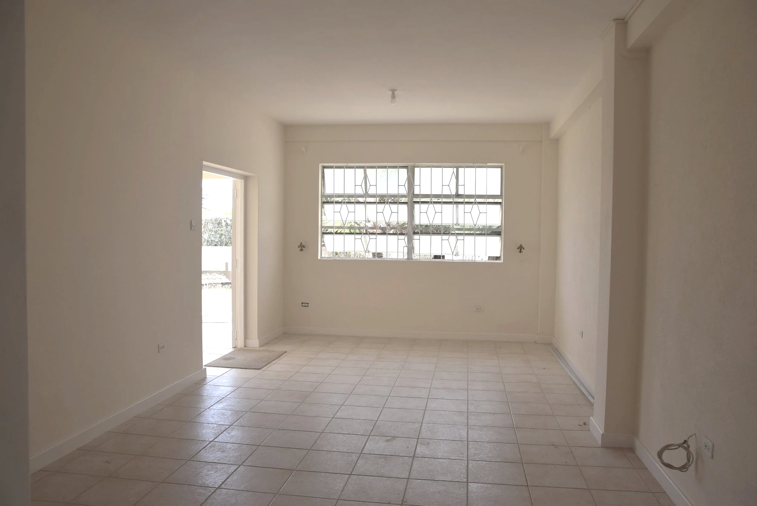 View of front door and living/dining area