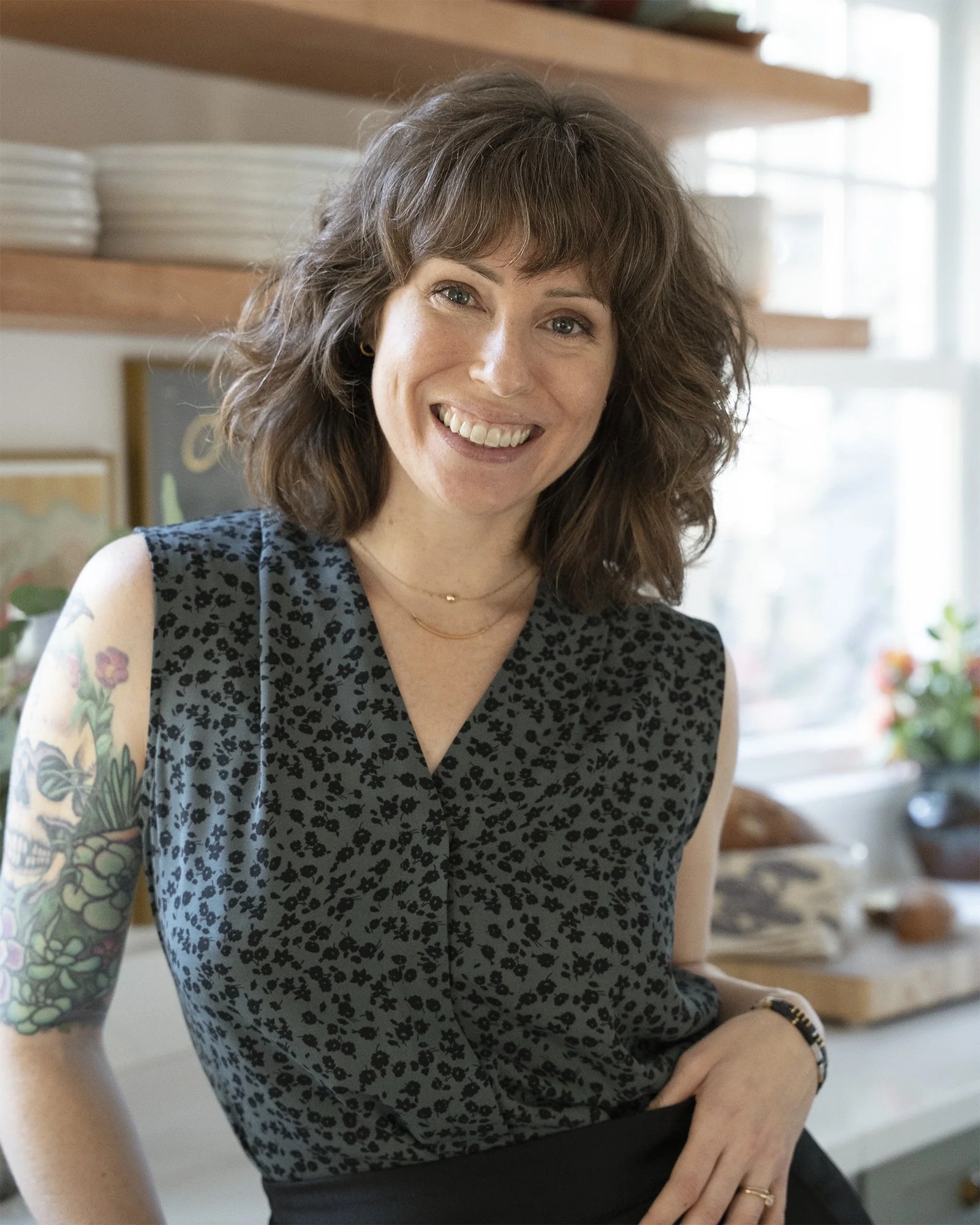 Brittany Rediger, founder and interior designer of Rediger Design, photographed in her Portland home kitchen.