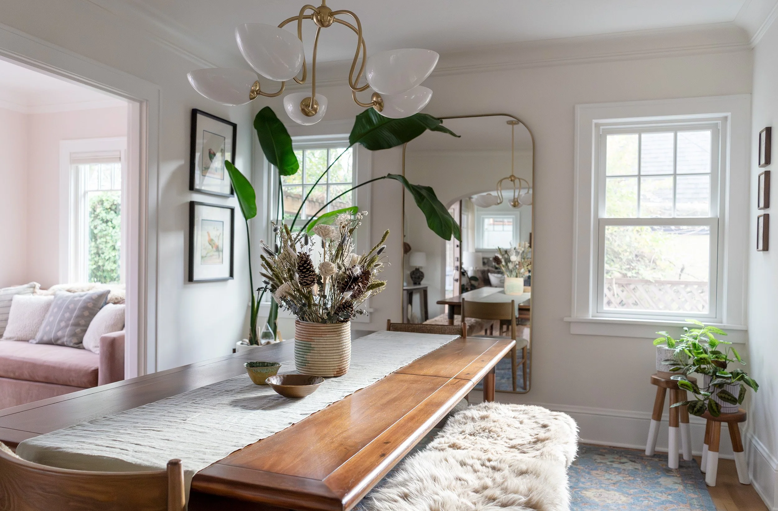 dining room refresh in Portland with acacia wood table, caramel lambskin benches, and vintage patterned rug