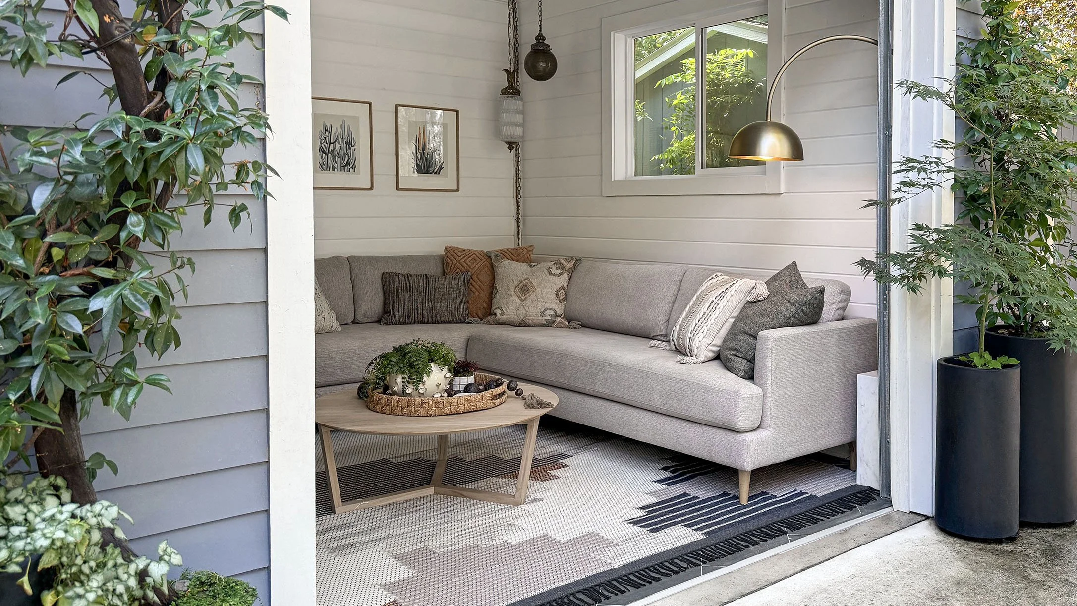 garage conversion lounge in Portland with wood plank walls, lounge seating, and herringbone tile flooring