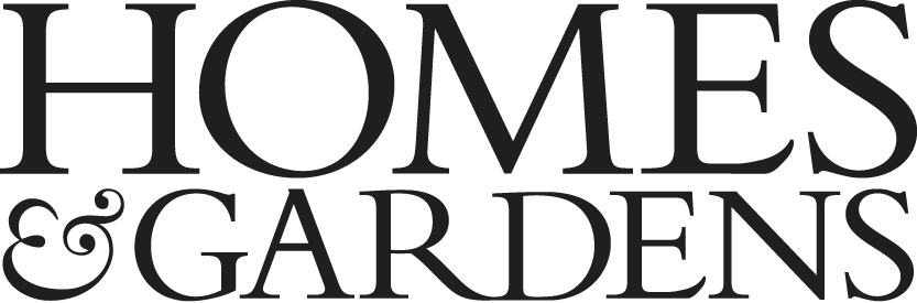 Close-up of black text reading 'HOMES & GARDENS' with a dark background.