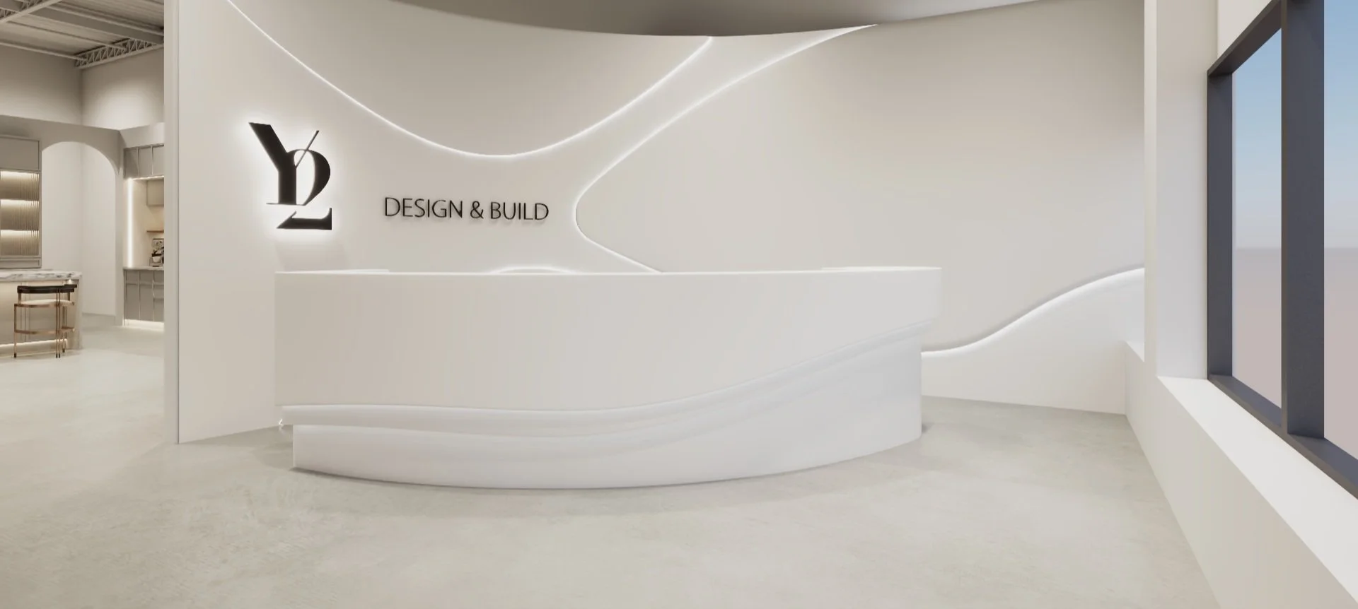 Modern reception area with white curved desk, illuminated abstract wall design, and a logo reading 'Y2 Design & Build' on the wall.
