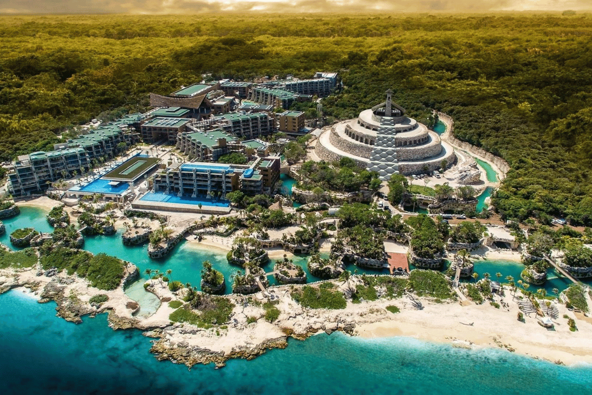 Hotel Xcaret Mexico aerial view showing resort layout, lagoons, pools and beachfront in Riviera Maya