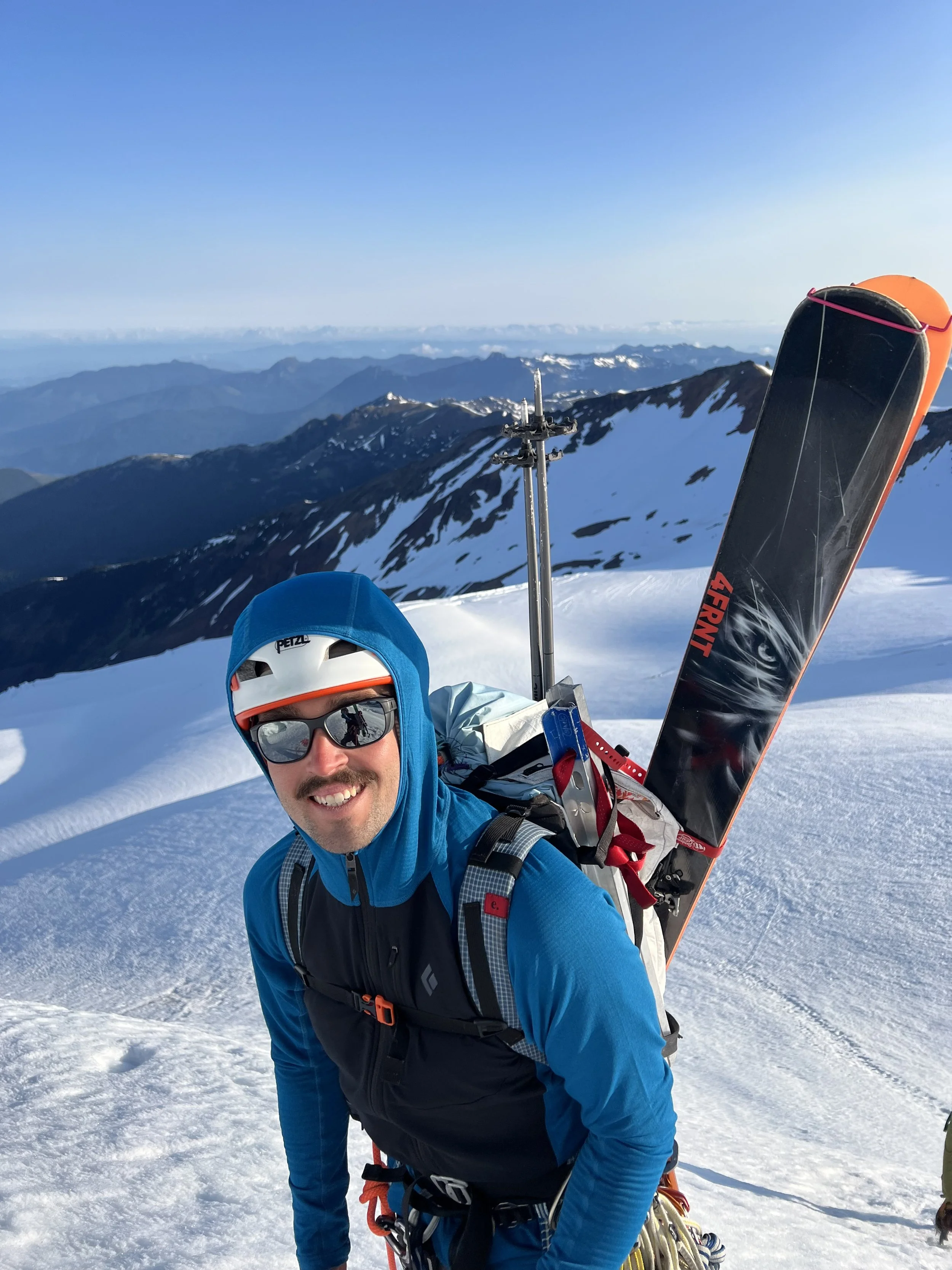 Matt showing the diagonal ski carry, the bottom ski loop tucks into a space behind the axe carry slot.