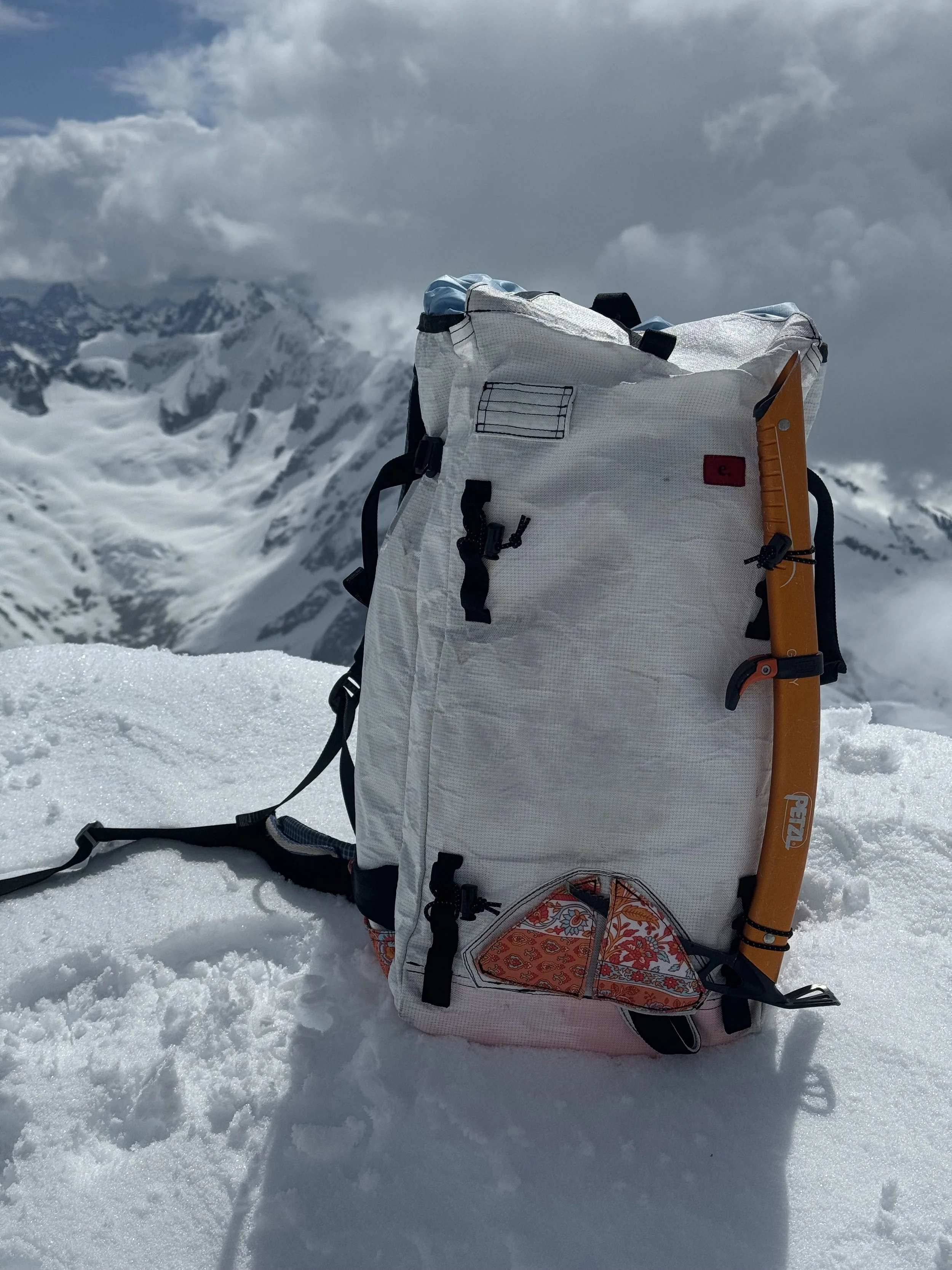 Single ice axe carry for snow oriented missions.