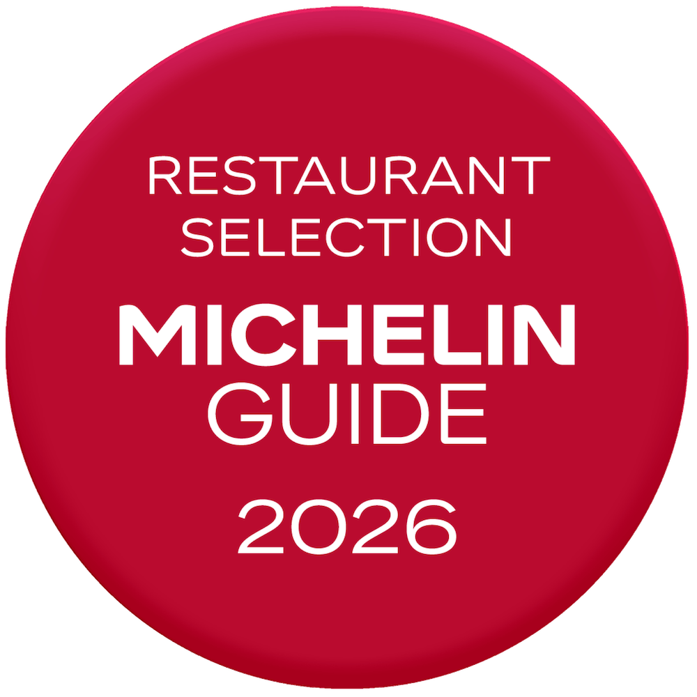 Red circular badge with white text listing 'Restaurant Selection Michelin Guide 2026'.