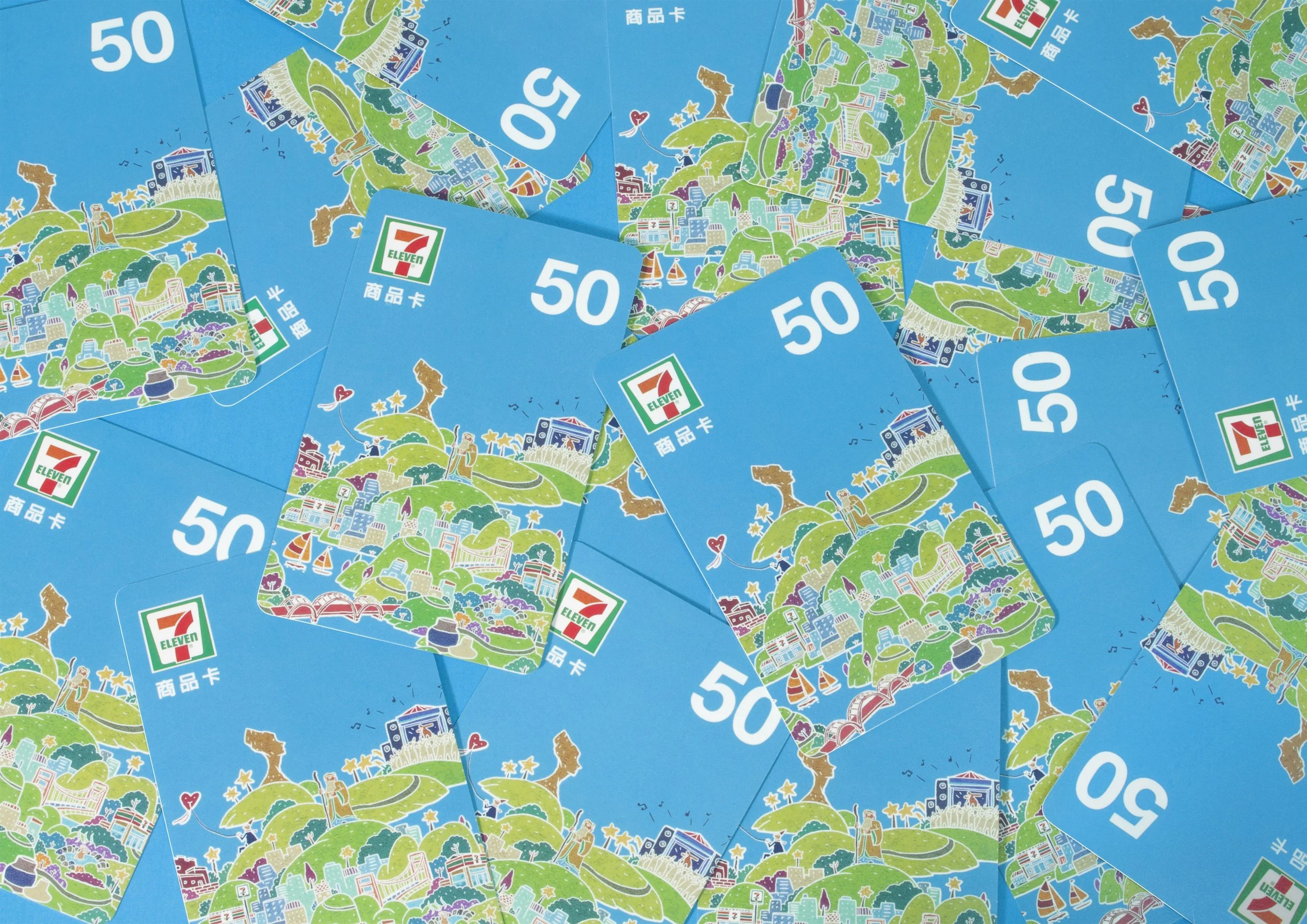 Multiple 50-dollar cards from 7-Eleven with colorful illustrations of a cityscape, greenery, a park with a fountain, boats, and a giraffe, on a blue background.