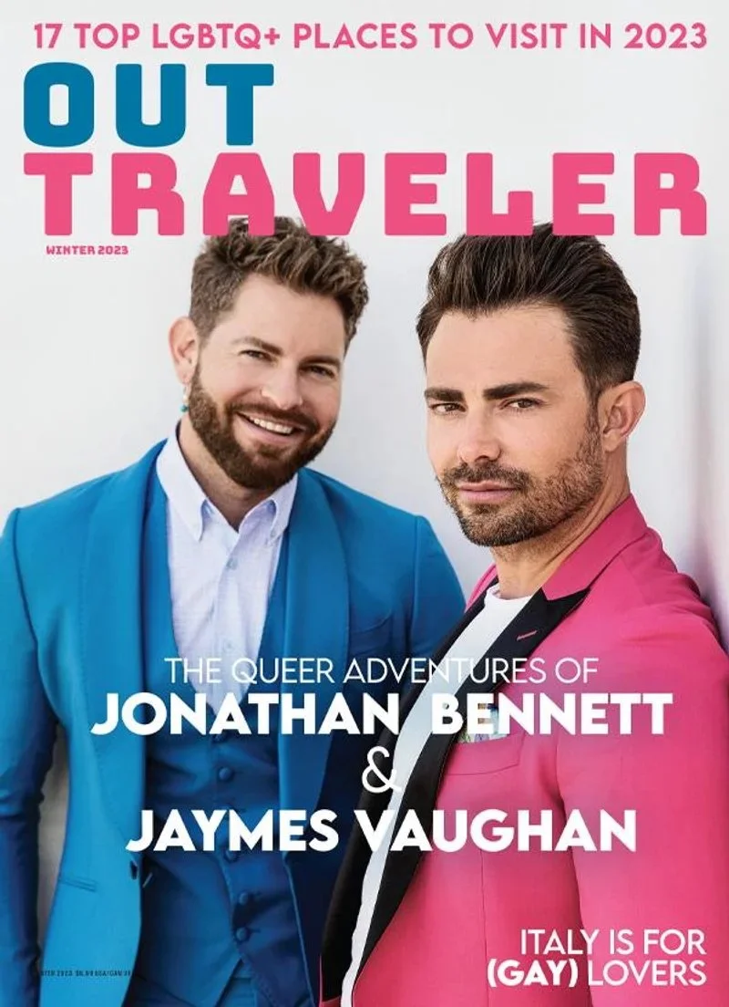 jonathan-bennett-in-pink-suit-and-jaymes-vaughan-in-blue-suit-on-the-cover-of-out-traveler-winter-2023.jpg.jpeg