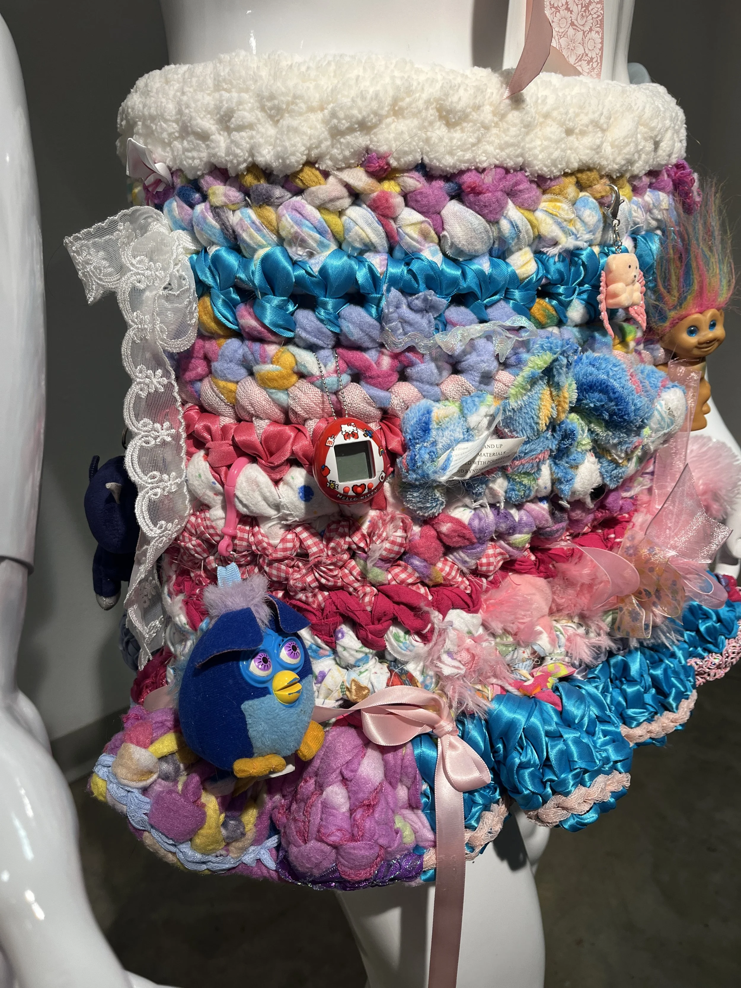 Destructive Fun(detail), 15 x 25 x 9”, Found objects, ribbon, thread, second-hand fabrics and stuffed animals, 2024