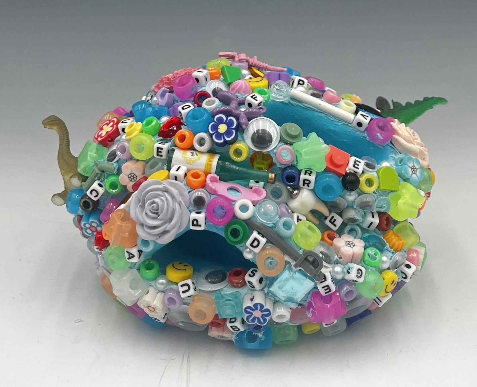 Glob #4, 3.5 x 7 x 4.5”, Ceramic, acrylic paint, found plastic objects, 2025