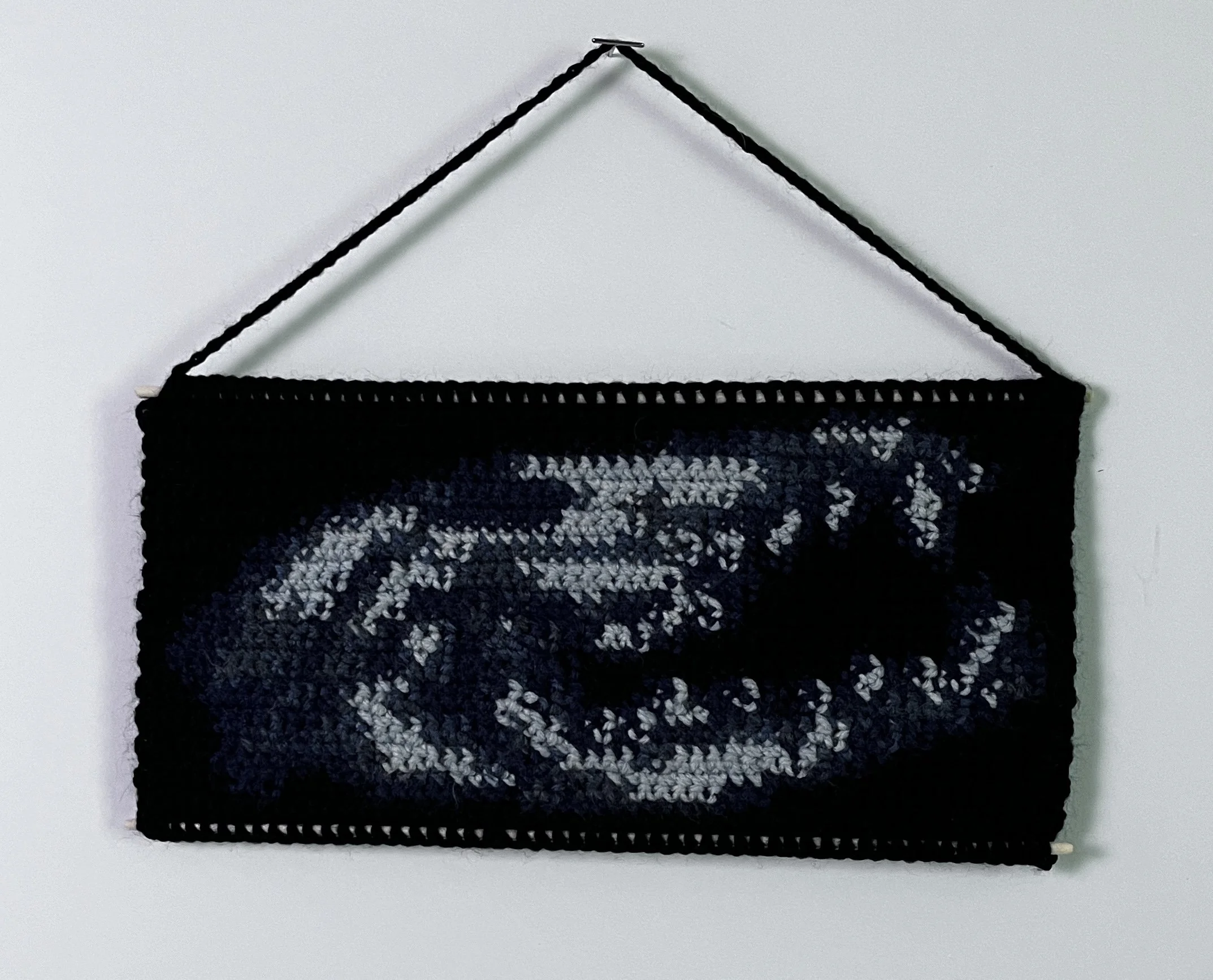 Fox Skull, 5 x 10.5”, acrylic yarn, wooden dowels, felt, 2026