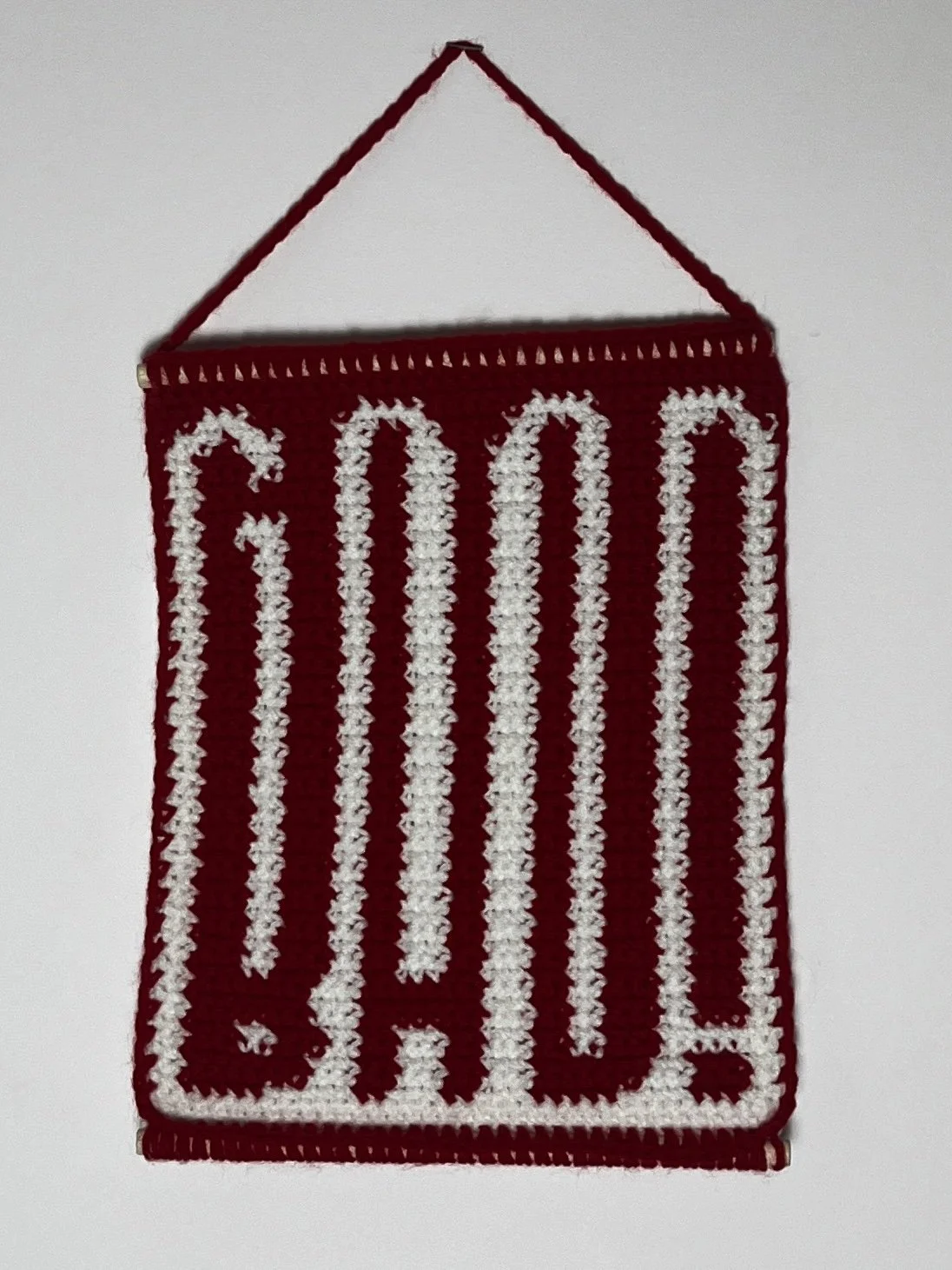 Good and Bad, 11.5(16.5 hanging) x 9.5", acrylic yarn, wooden dowels, 2025