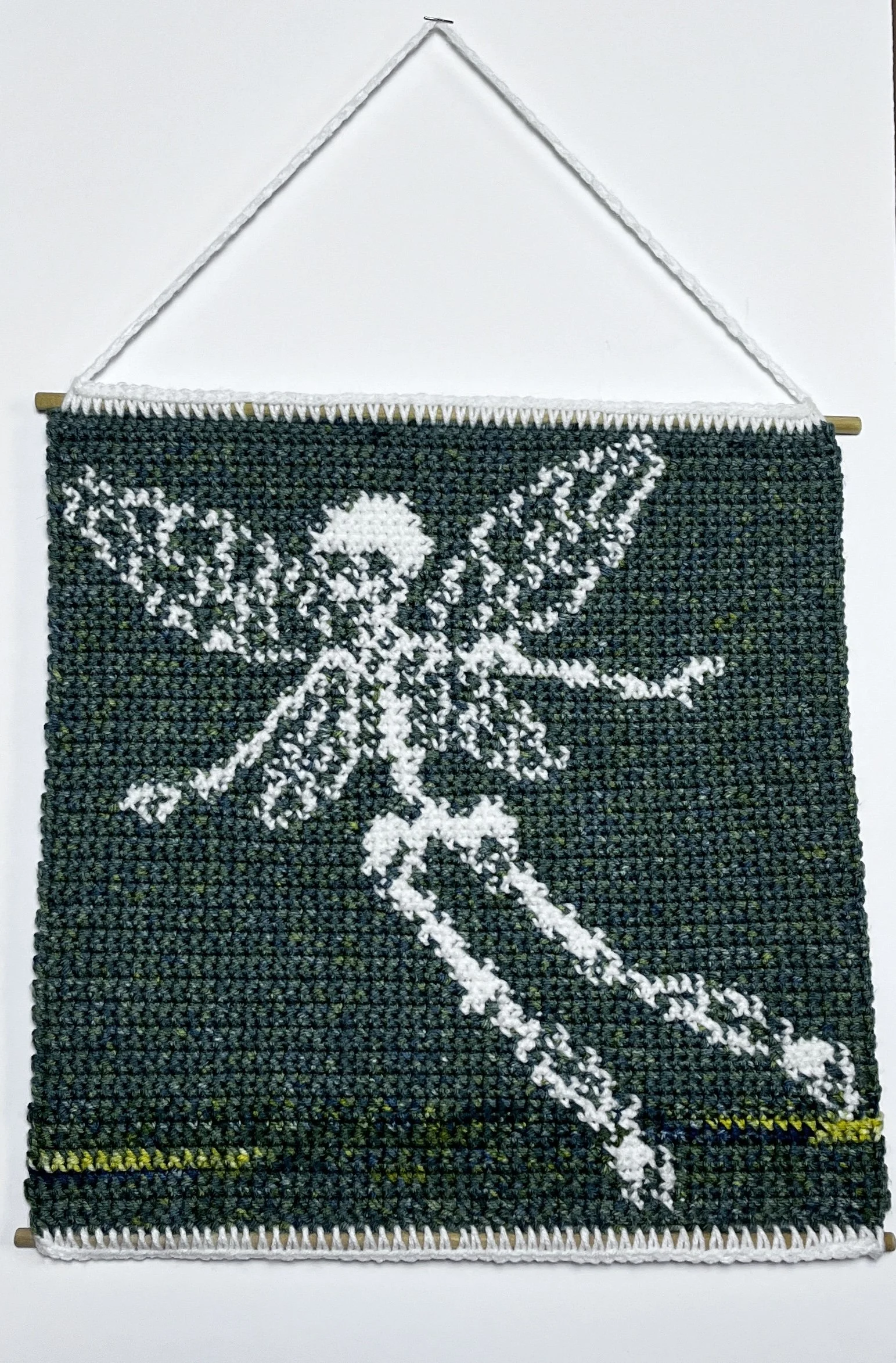Skelefairy, 15 x 15”, acrylic yarn, wooden dowels, felt,  2025